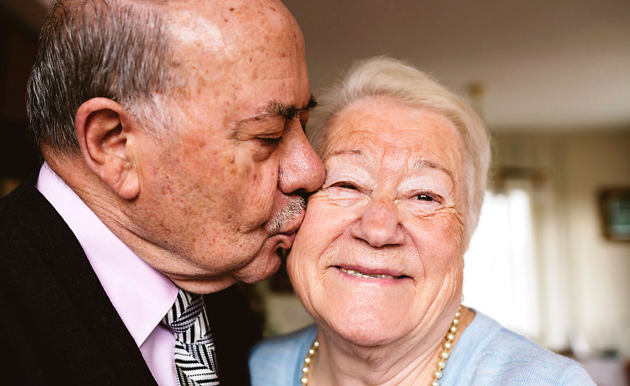 Old man kissing old partner or soulmate